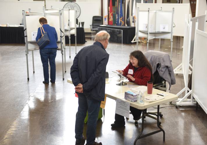 Gail Robinson checks voters in at Deerfield Town Hall during the 2023 town election. Deerfield’s deadline to register to vote in this year’s town election is Friday, April 19, at 5 p.m.