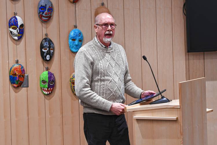 Michael Nix, a finalist in the adult category, reads his poem “Barton Cove” at the Poet’s Seat Poetry Contest awards ceremony at the Greenfield Public Library on Tuesday evening.