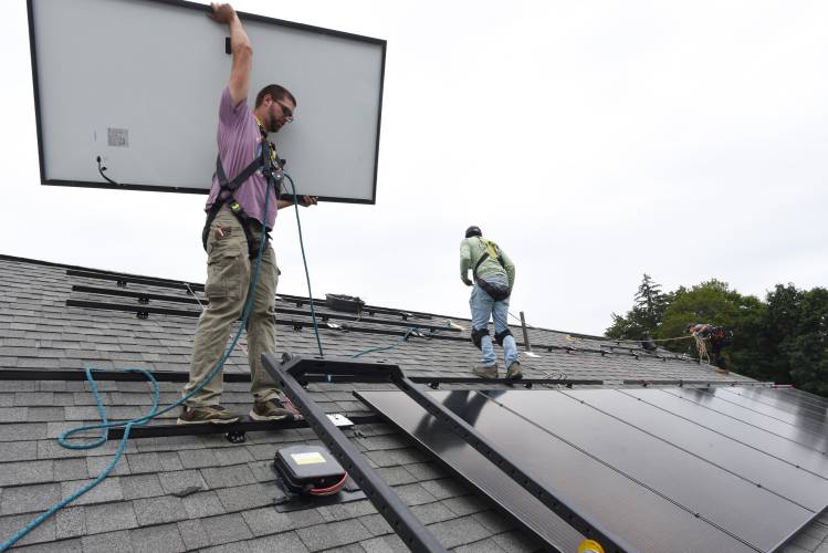 Josh Chapley and others of PV Squared install a solar array on the Greenfield Department of Public Works building in August 2023. Solar energy options and more will be explored during a free Energy Fair organized by the Shelburne Energy Committee on Saturday.