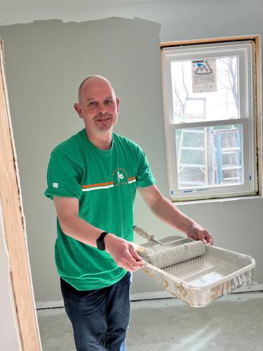 Jeremy Payson of Greenfield Cooperative Bank recently volunteered to help paint a Pioneer Valley Habitat for Humanity house.