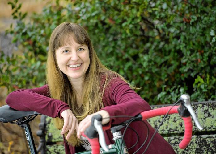 Author and cycling enthusiast Christina Uss comes to the Easthampton Public Library May 8 to talk books, bicycling, and fixing a flat tire.