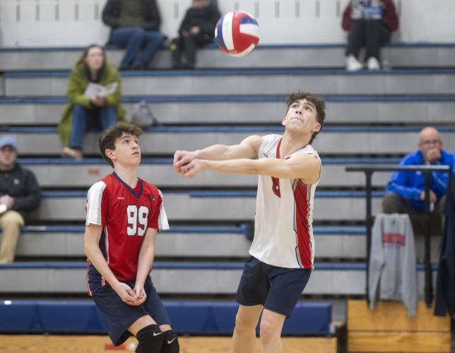 Frontier's Evan Maio (99) watches Nathan Rivera, right, bump the ball during the volleyball game against West Springfield at Frontier High School, Tuesday, April 8, 2025, in South Deerfield.