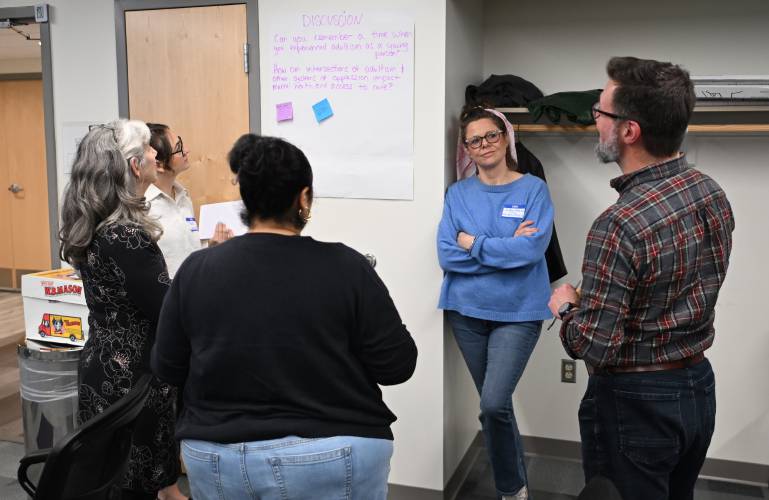 Attendees participate in group discussions during a Youth Partnership Summit hosted by the Community Health Center of Franklin County at its Greenfield offices at 102 Main St. on Friday.