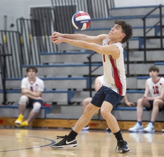 Frontier's Nathan Rivera bumps the ball during the volleyball game against West Springfield at Frontier High School, Tuesday, April 8, 2025, in South Deerfield.