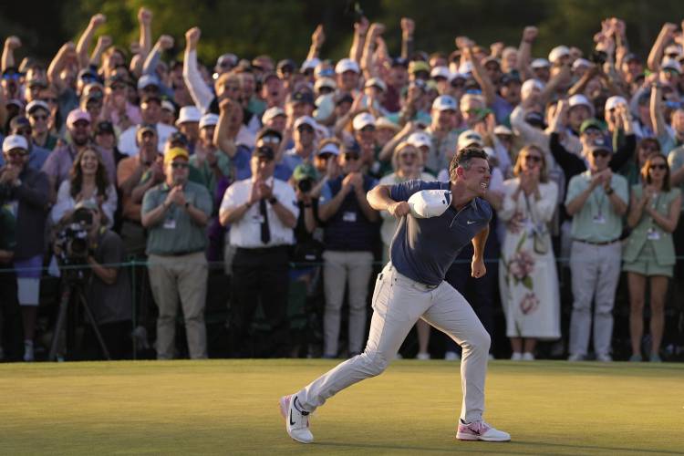 Rory McIlroy, of Northern Ireland, reacts after winning in a playoff against Justin Rose after the final round at the Masters golf tournament, Sunday, April 13, 2025, in Augusta, Ga. (AP Photo/Ashley Landis)