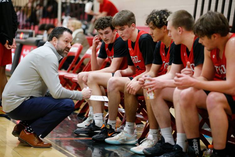 Athol head coach Brian Patria talks with his team in between quarters against Hampshire Regional in Westhampton last year. 