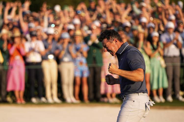 Rory McIlroy, of Northern Ireland, reacts after winning in a playoff against Justin Rose after the final round at the Masters golf tournament, Sunday, April 13, 2025, in Augusta, Ga. (AP Photo/Julia Demaree Nikhinson)