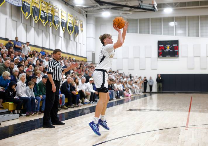 Pioneer’s Jackson Glazier (4) hits a three-pointer against Ware in the second quarter of the MIAA Division 5 quarterfinal Friday night in Northfield.