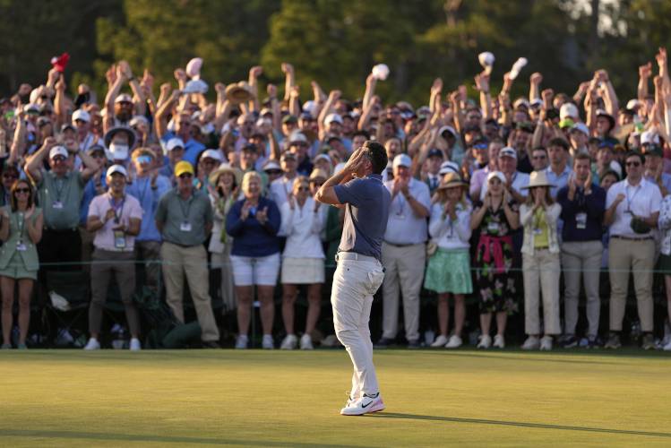 Rory McIlroy, of Northern Ireland, reacts after winning in a playoff against Justin Rose after the final round at the Masters golf tournament, Sunday, April 13, 2025, in Augusta, Ga. (AP Photo/Ashley Landis)
