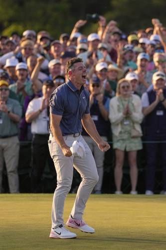 Rory McIlroy, of Northern Ireland, reacts after winning in a playoff against Justin Rose after the final round at the Masters golf tournament, Sunday, April 13, 2025, in Augusta, Ga. (AP Photo/Ashley Landis)