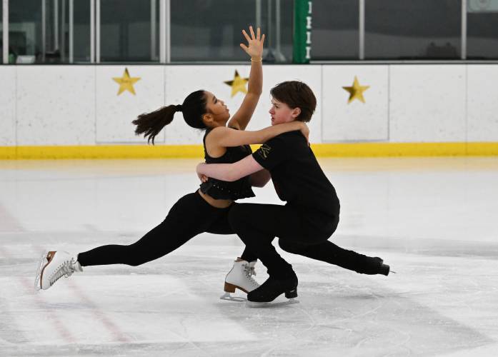 Guest skaters Mia Aisin and Steven Moore, National Development Team ice dancers, perform at the ice rink at Deerfield Academy during the New England West Skating Show on Saturday. 