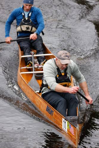 Brent Lyesiuk and John Berry paddle their way to a second place finish during the 60th annual River Rat Race from Athol to Orange on Saturday.