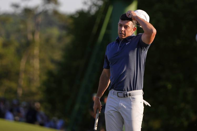 Rory McIlroy, of Northern Ireland, reacts after a bogey on the 18th hole during the final round at the Masters golf tournament, Sunday, April 13, 2025, in Augusta, Ga. (AP Photo/Julia Demaree Nikhinson)