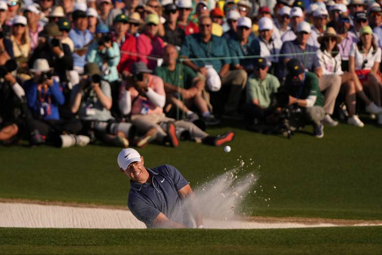 Rory McIlroy, of Northern Ireland, hits from the bunker on the 18th hole during the final round at the Masters golf tournament, Sunday, April 13, 2025, in Augusta, Ga. (AP Photo/Julia Demaree Nikhinson)