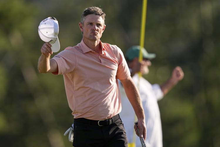 Justin Rose celebrates after a birdie on the 18th hole during the final round at the Masters golf tournament, Sunday, April 13, 2025, in Augusta, Ga. (AP Photo/David J. Phillip)