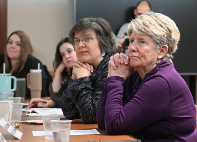 Director of Community Health at the Franklin Regional Council of Governments Phoebe Walker and Greenfield Mayor Ginny Desorgher listen to speakers at Baystate Franklin Medical Center on Tuesday to discuss the opioid epidemic response in western Massachusetts. 
