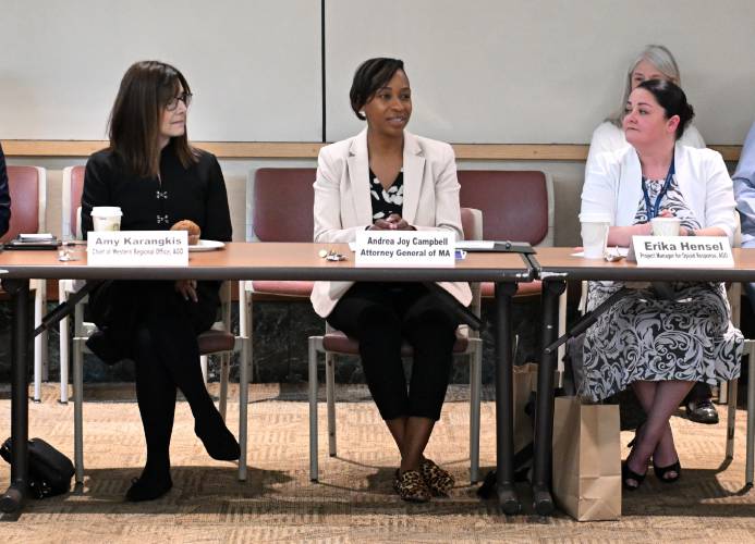 Massachusetts Attorney General Andrea Joy Campbell, center, is flanked by Amy Karangekis, chief of the AG’s western regional office, left, and Erika Hensel, the AG’s project manager for opioid response, right, at a meeting of officials on Tuesday to discuss the opioid epidemic response in western Massachusetts.