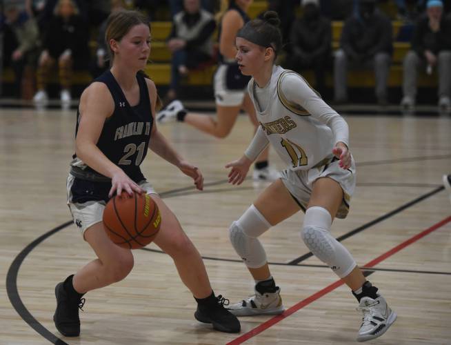 Franklin Tech’s Hannah Gilbert handles the ball while defended by Pioneer’s Kyler McClelland last year in Northfield. 