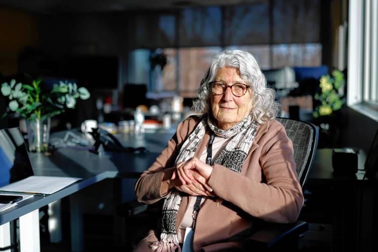 President and CEO of ServiceNet Sue Stubbs sits at her desk for a portrait at the nonprofit’s headquarters at Village Hill in Northampton.