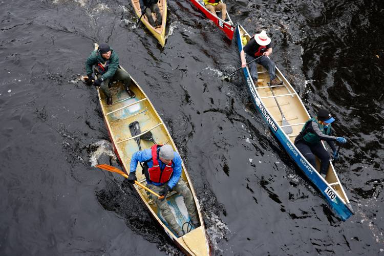 Competitors make their way down the Millers River during the 60th annual River Rat Race from Athol to Orange on Saturday.