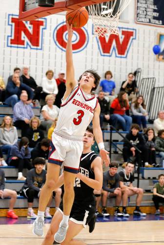 Frontier’s Nico Fasulo (3) puts in a breakaway layup against Pioneer in the second quarter Friday night at Goodnow Gymnasium in South Deerfield.