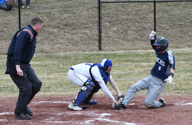 Turners Falls catcher Kainen Stevens tags out Franklin Tech’s William Ainsworth at home at the Bourdeau Fields Complex in Turners Falls earlier this season.