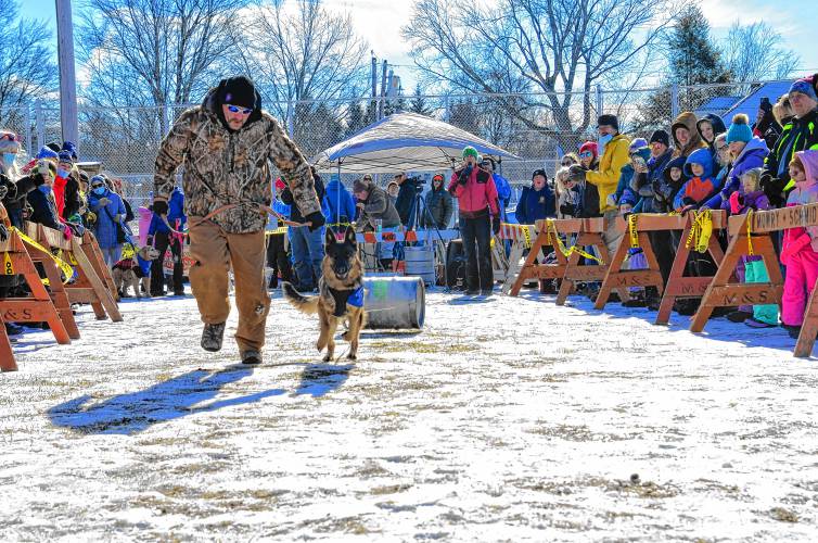 Participants in the K-9 Keg Pull at Greenfield’s Winter Carnival in 2022.