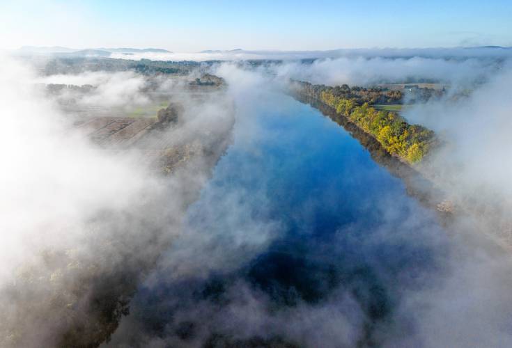 Fog rolls over the Connecticut River, looking south from Mount Sugarloaf.