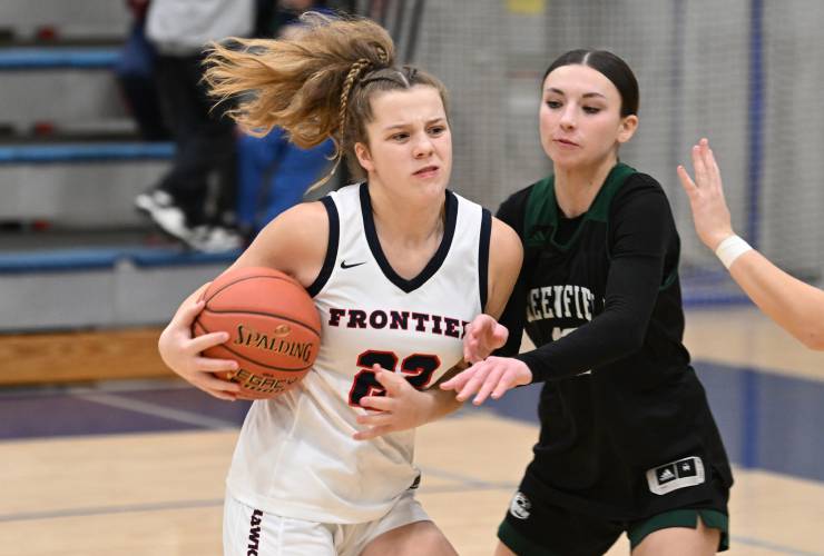 Frontier’s Harper Modestow tries to shoot past Greenfields Tayler Bergeron at Goodnow Gymnasium Thursday. 