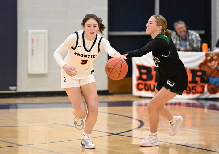 Frontier’s Addie Harrington picks off a pass intended for Greenfield’s Natalia Cody at Goodnow Gymnasium Thursday. 