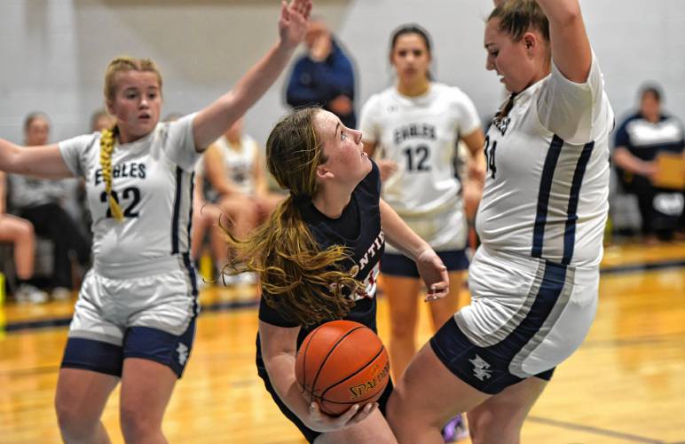 Frontier’s Skyler Steele (10) looks to get a shot up between Franklin Tech defenders Madyson Lynde (22) and Lilianna Inman (34) during the visiting Redhawks’ victory on Friday night in Turners Falls.