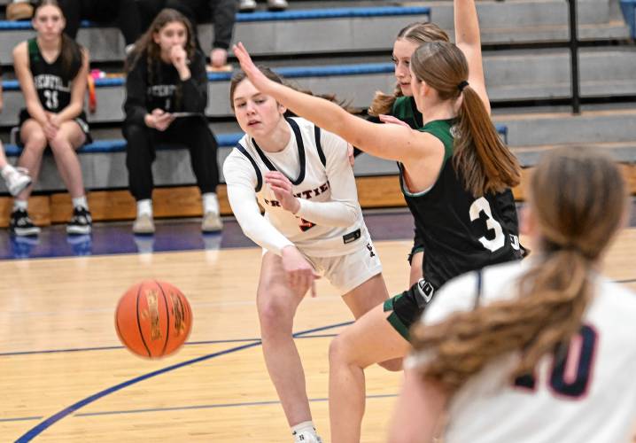 Frontier’s Addie Harrington passes to Skyler Steele against Greenfield at Goodnow Gymnasium Thursday. 
