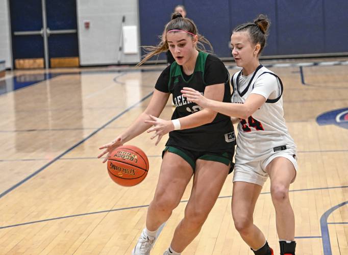 Greenfield’s Elderina Cecunjanin drives past Frontier’s Jazzy Hayes at Goodnow Gymnasium Thursday. 