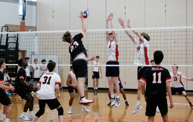 Frontier puts up a block against Belchertown last season in Belchertown.