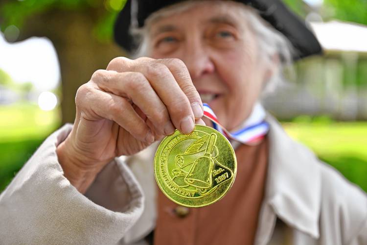 Kathy-Ann Becker, with her official town crier medallion, is the town crier in Wendell.