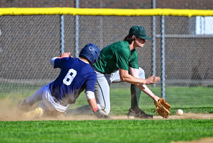 Frontier’s Rosco Palmer slides into third just before Greenfield’s Michael Pierce received the ball on Thursday in South Deerfield. 