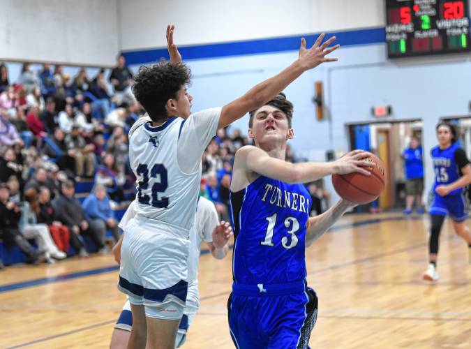 Turners Falls’ Jackson Cogswell (13) goes to the basket during the visiting Thunder’s 55-35 Hampshire League North victory on Tuesday night in Turners Falls.