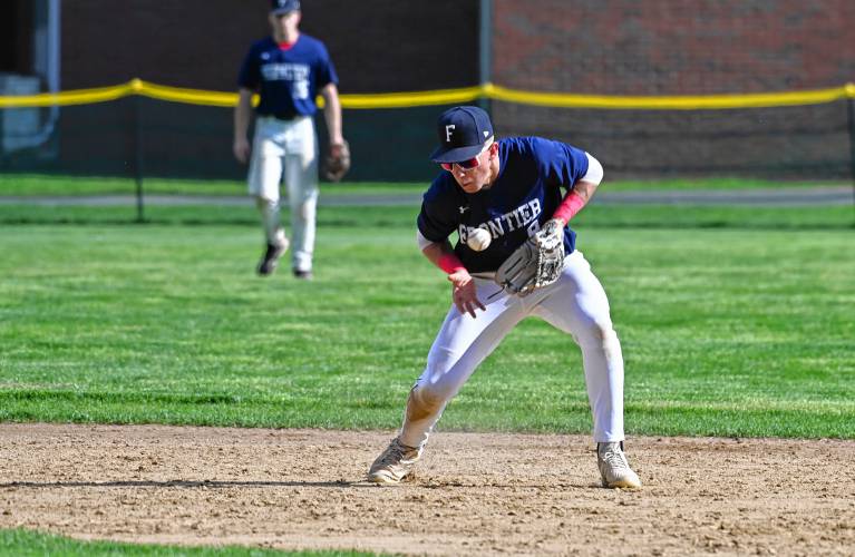 Frontier’s shortstop Rosco Palmer gathers a grounder for the out against Greenfield in South Deerfield on Thursday. 