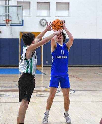 Four Rivers’ Cooper Whitney shoots against Hartsbrook during the River Valley Athletic League championship game in Greenfield on Thursday.