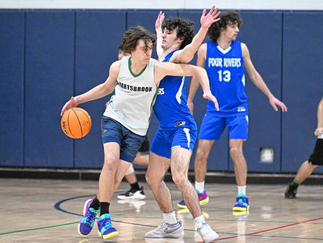 Hartsbrook’s Das Khalsa is defended by Four Rivers’ Cooper Whitney during the River Valley Athletic League championship game in Greenfield on Thursday.