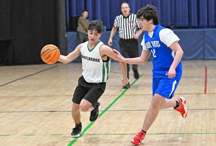 Hartsbrook’s Rowen Novik is defended by Four Rivers’ Ethan Hannon during the River Valley Athletic League championship game in Greenfield on Thursday.