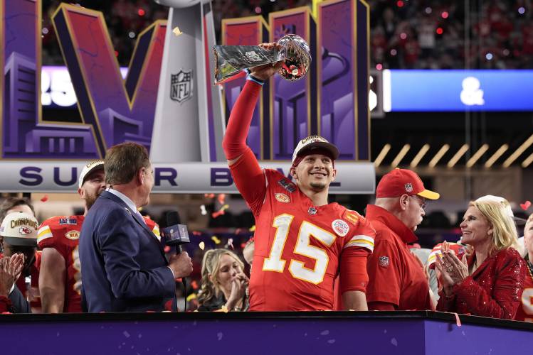 Kansas City Chiefs quarterback Patrick Mahomes (15) holds the Vince Lombardi Trophy after the NFL Super Bowl 58 football game against the San Francisco 49ers, Sunday, Feb. 11, 2024, in Las Vegas. The Chiefs won 25-22. (AP Photo/John Locher)