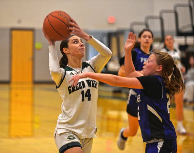 Greenfield's Mackensie Goncalves goes up for a layup while guarded by Palmer's Harper Brouillette on Friday at Nichols Gymnasium in Greenfield. 