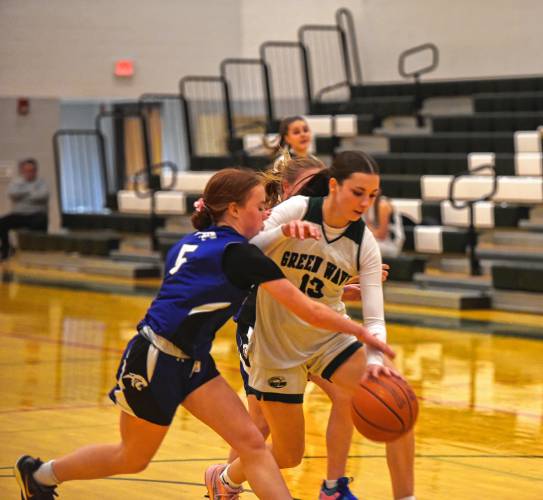 Greenfield's Tayler Bergeron gets fouled by Palmer's Anabelle Ladue on Friday at Nichols Gymnasium in Greenfield. 