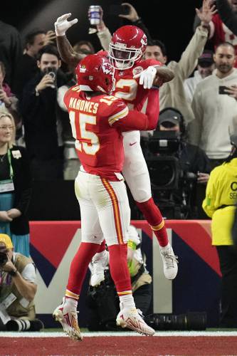 Kansas City Chiefs quarterback Patrick Mahomes (15) celebrates with wide receiver Mecole Hardman Jr. (12) after Hardman scored the game-winning touchdown against the San Francisco 49ers in overtime during the NFL Super Bowl 58 football game Sunday, Feb. 11, 2024, in Las Vegas. The Chiefs won 25-22. (AP Photo/John Locher)