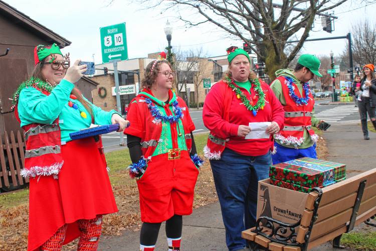 Staff of the Greenfield Recreation Department explain the rules of The Amazing Race: Jinglefest Edition on Saturday.
