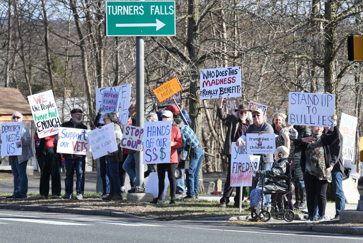 Demonstrators protest the Trump administration during weekly standouts at the intersection of Route 2 and Main Road in Gill.