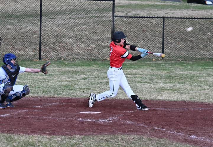 Athol’s Logan Cormier knocks one over the fence against Turners Falls in Montague on Tuesday.