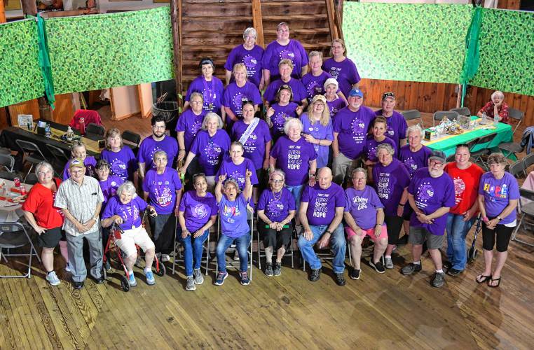 Cancer survivors pose for a photo in the Roundhouse before the start of Relay For Life of Franklin County at the Franklin County Fairgrounds on Friday evening. 