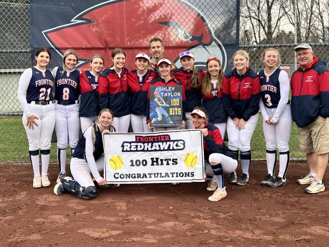 Frontier's Ashley Taylor with teammates after recording her 100th career hit on Tuesday in South Deerfield.